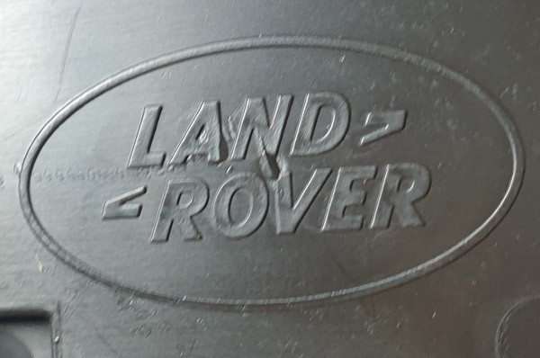 Range Rover osłona prowadnicy fotela przód lewa LR113449 JK52-131K13-ABW ORG NOWY